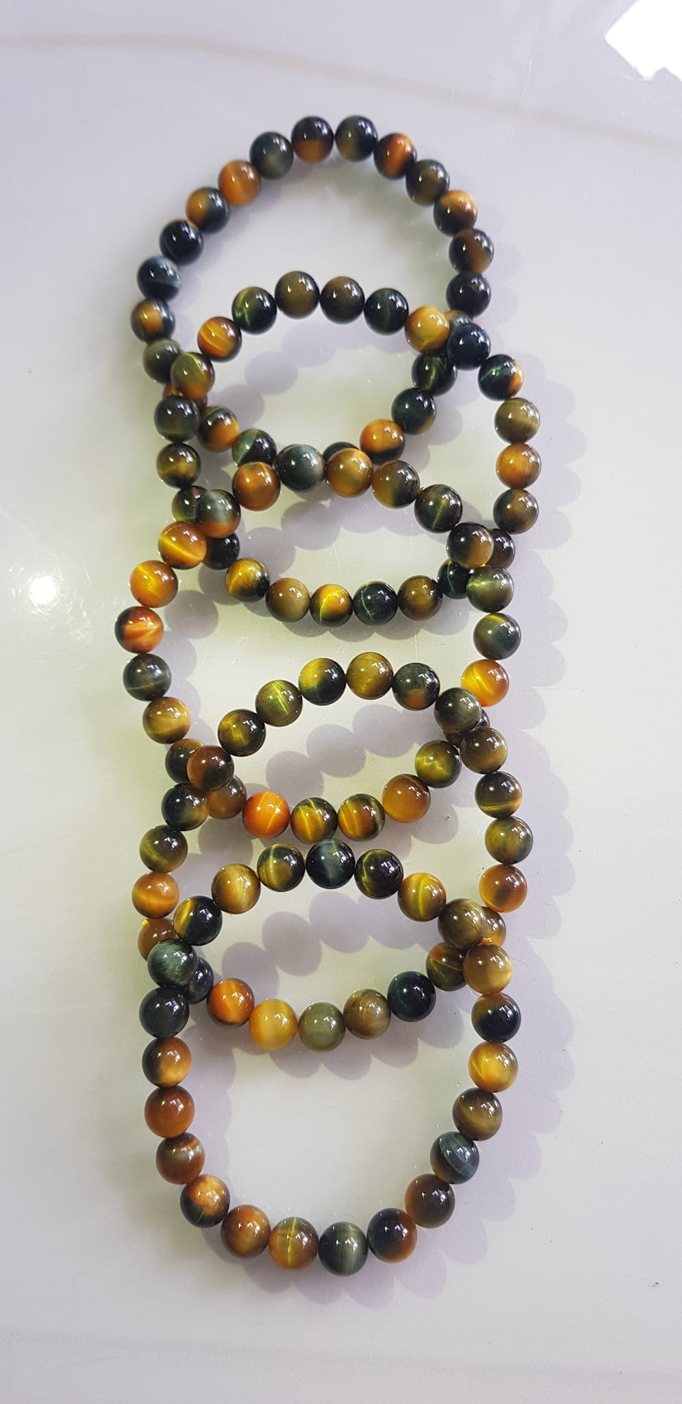 Vòng tay phong thủy may mắn Nữ đá mắt hổ tự nhiên vàng xanh đều mới bóng mượt đẹp Size hạt 8mm Nữ đeo Công dụng vòng đá mắt hổ đá thiên nhiên tốt cho sức khỏe, đem đến may mắn,xoa dịu tâm trí công việc hanh thông ạ