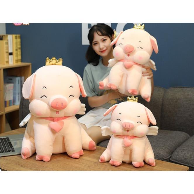 Gấu Bông Heo Vương Miện Đeo Chuông Tim Ngồi Lợn Bông Mềm Mịn 60cm