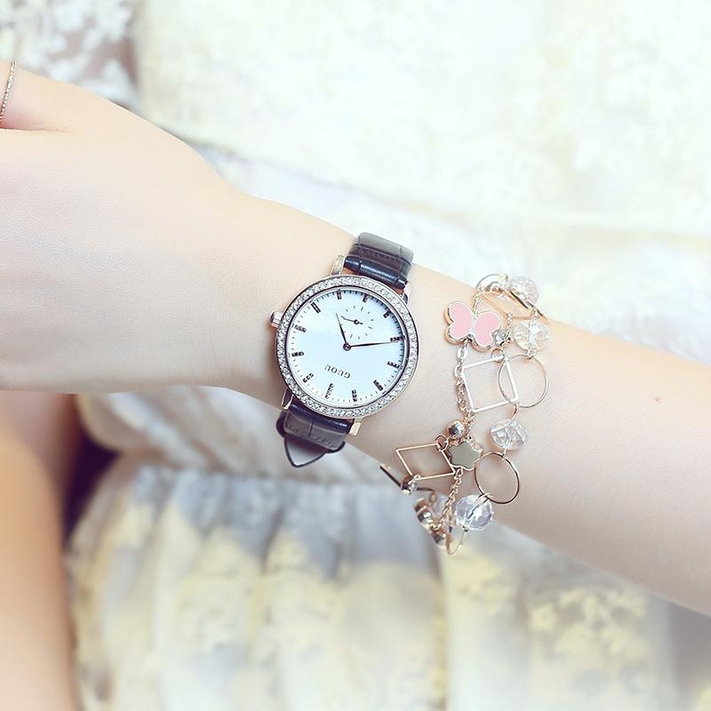 Đồng hồ đeo tay nữ chính hãng Guou dây da số vạch đẹp kim rốn viền đính đá chống nướ