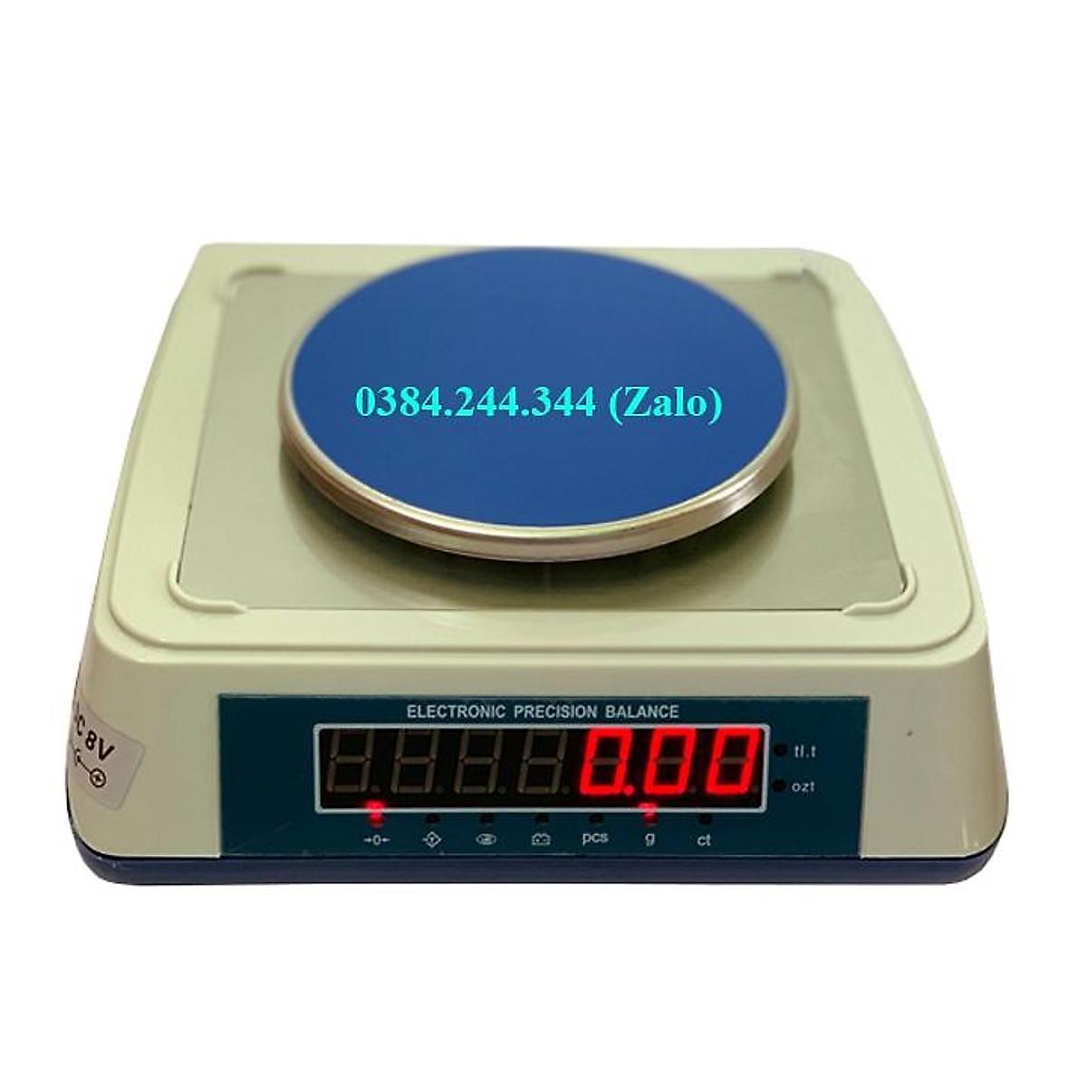 Bộ sản phẩm cân mẫu vải ngành may mặc bao gồm cân điện tử KD-TBED 300g/0.01g, dao cắt mẫu 10cm2 và 4 lưỡi dao thay thế