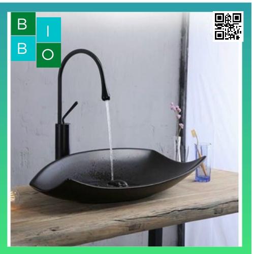 Chậu sứ lavabo đặt bàn màu đen hình chiếc lá