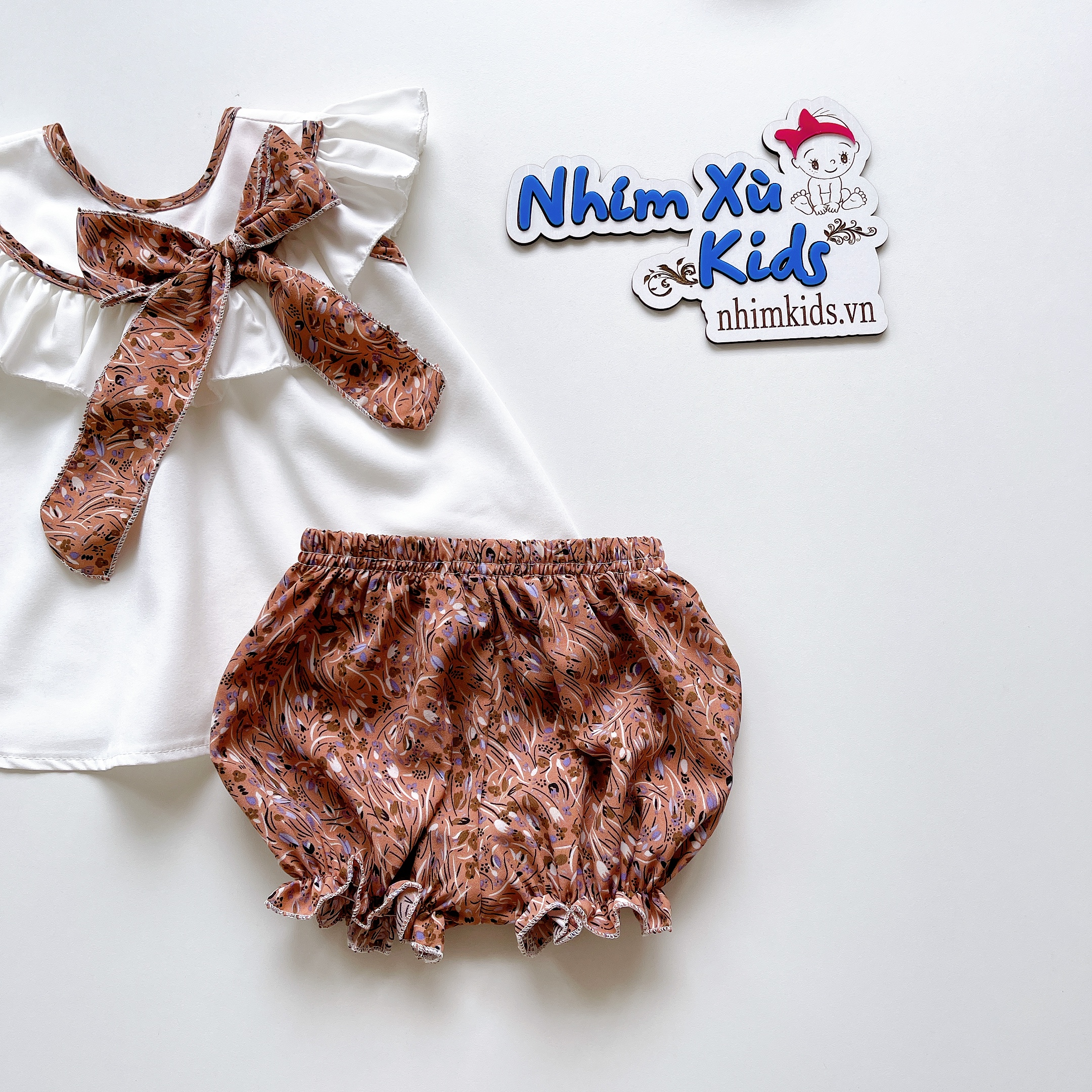 Bộ Áo Quần Nơ Nhí Nâu Bé Gái 4 Đến 30kg Chất Lụa Mềm Mát