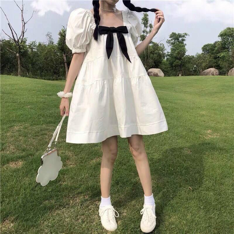 Váy đầm nữ dáng babydoll màu trắng cột nơ cổ tay bồng nữ tính