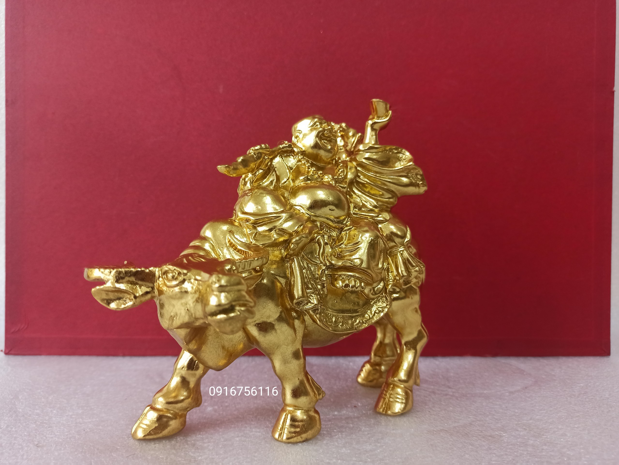 Di lặc dát vàng di lặc cưỡi trâu bằng đồng thau dát vàng tượng thần tài cưỡi trâu đồng thau dát vàng tài lộc hàng VIP