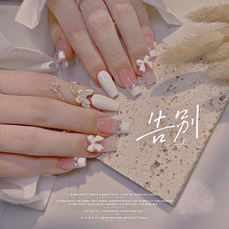 Nailbox thiết kế   - mẫu nail trắng chram nơ xinh chảnh