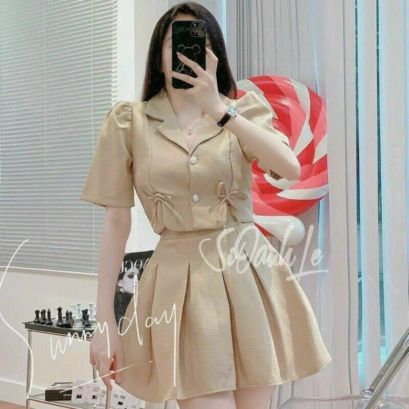 Sét áo vest phom lửng đính nơ và chân váy xoè xếp ly