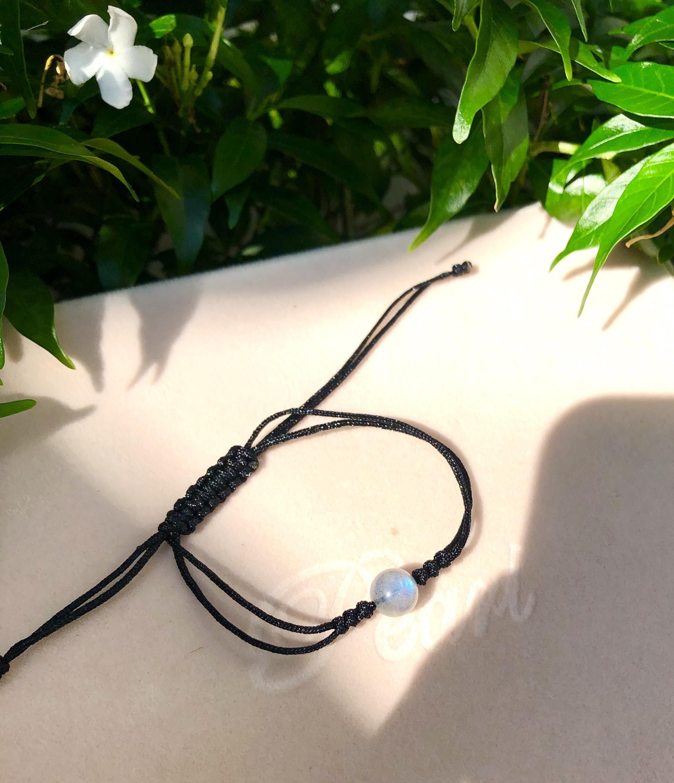 Vòng tay đá xà cừ đan dây đen hạt 8mm