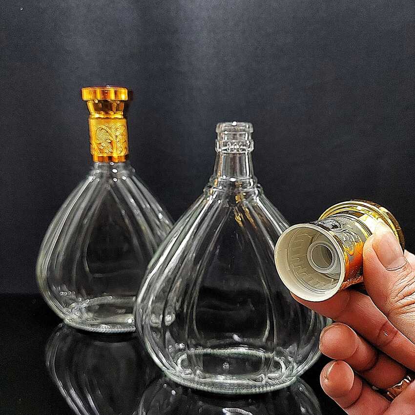 Vỏ Chai Rượu Ngoại 500ML giọt nước hoa văn cánh sen nắp vàng chuôi đỏ - Chai Đựng Rượu Thủy Tinh - Vỏ Chai Rượu Đẹp – Bình Đựng Rượu Thủy Tinh