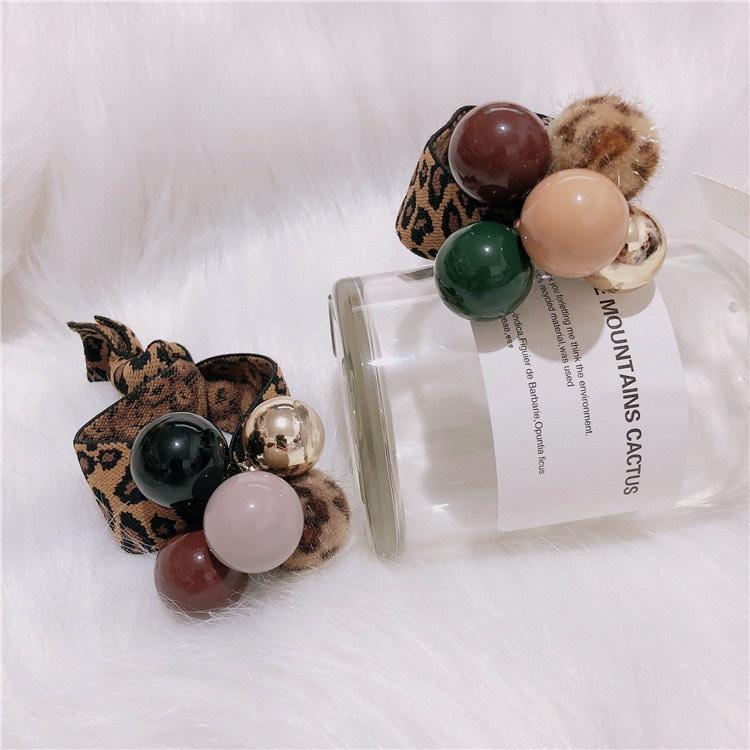 CỘT TÓC THUN DA BEO GẮN CHÂU PHONG CÁCH - NUNAM SHOP