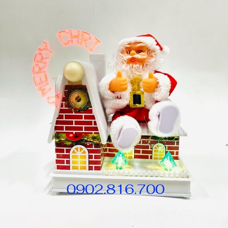 Đồ chơi ông già noel ngồi mái nhà xoay nhạc đèn quà tặng noel giáng sinh cho bé