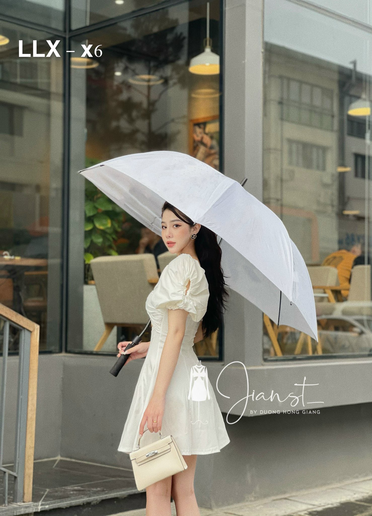 Đầm cúp xoắn ngực tay phồng