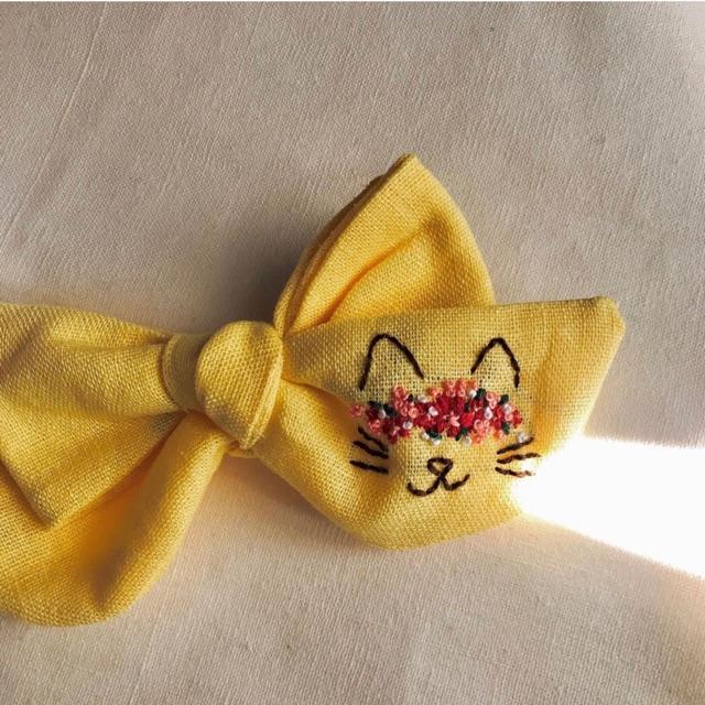 Nơ mặt mèo linen màu vàng siêu đáng yêu