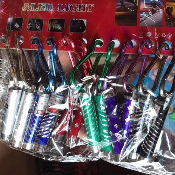 Vỉ 12 chiếc móc khoá đèn laze