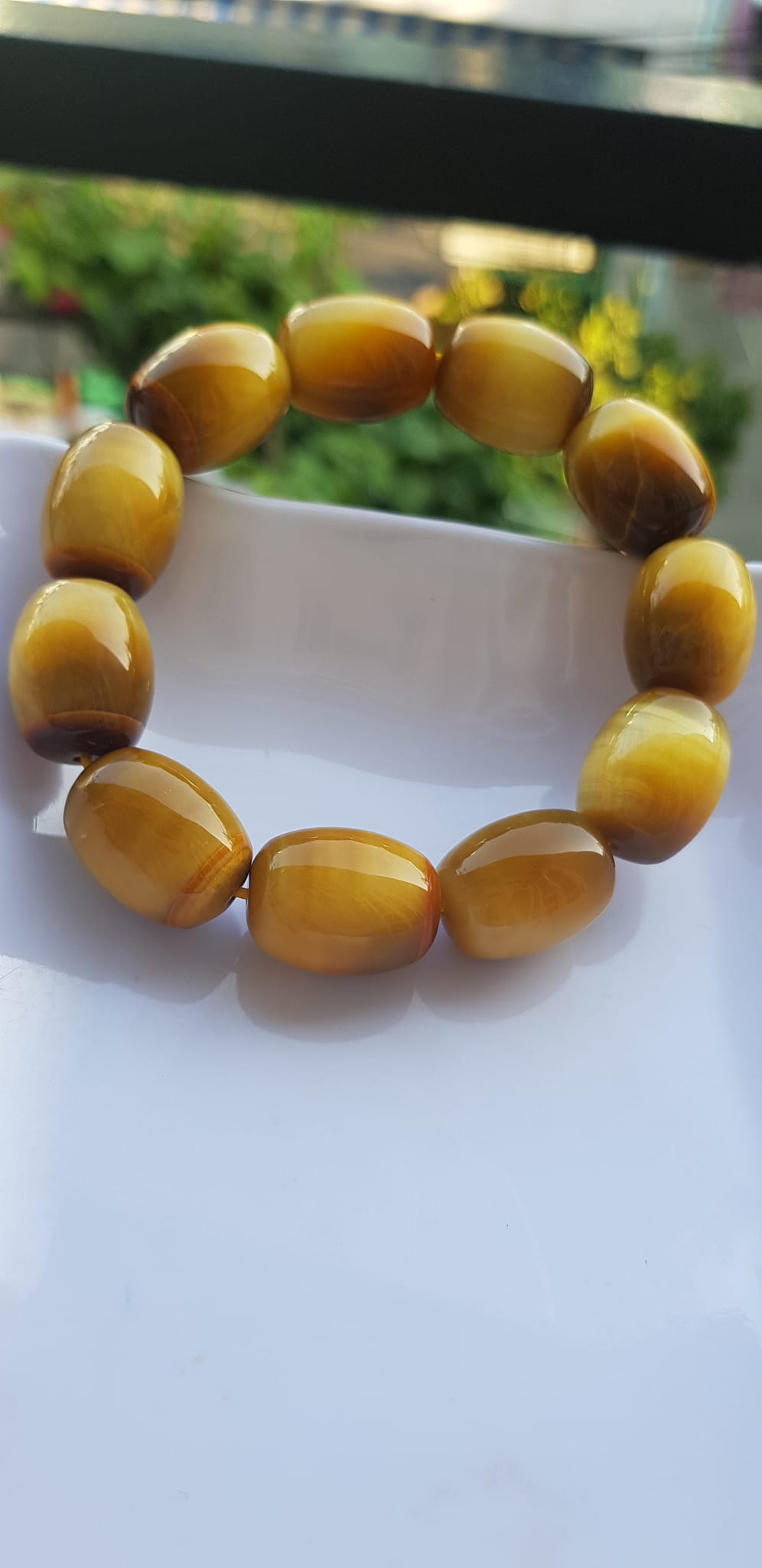Vòng Tay Phong Thủy Nam Mệnh Thổ Kim Thủy Mới Đẹp Hạt Lu Thống Mới Vàng Nâu bóng đẹp Chất liệu đá mắt hổ tự nhiên vàng nâu bóng đẹp ạ Size hạt 14mm x dài 19mm ạ
