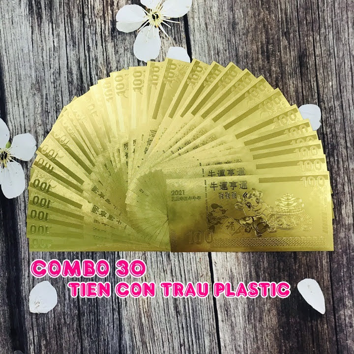 Combo 30 tờ lưu niệm 100 hình con Trâu, chất liệu nhựa plastic mạ một lớp màu vàng, dùng để trang trí trong nhà, làm tiền lì xì dịp Tết Tân Sửu 2021, treo trên cây mai, bỏ vào túi xách - SP005096