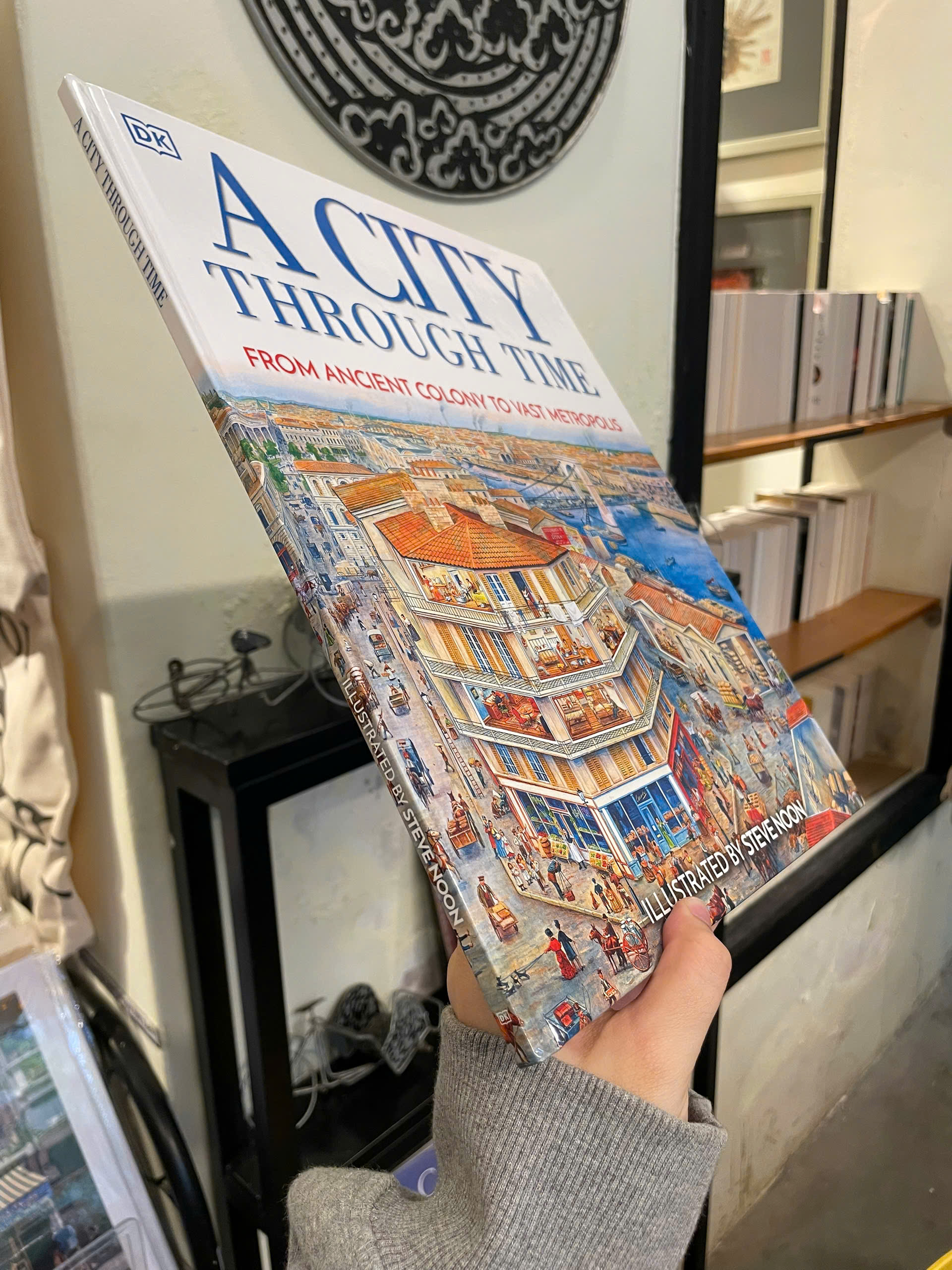 Sách - A City Through Time: From Ancient Colony To Vast Metropolis by Steve Noon - Bìa Cứng