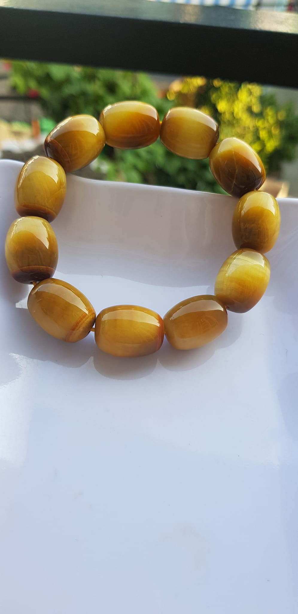 Vòng Tay Phong Thủy Nam Mệnh Thổ Kim Thủy Mới Đẹp Hạt Lu Thống Mới Vàng Nâu bóng đẹp Chất liệu đá mắt hổ tự nhiên vàng nâu bóng đẹp ạ Size hạt 14mm x dài 19mm ạ