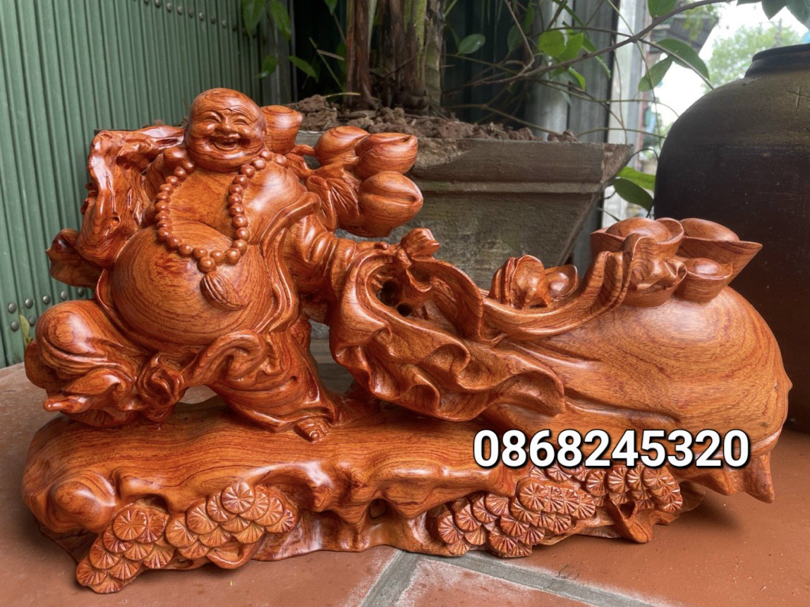 Tượng phật di lặc kéo bao tiền bầng gỗ hương đá kt 50×27×13cm