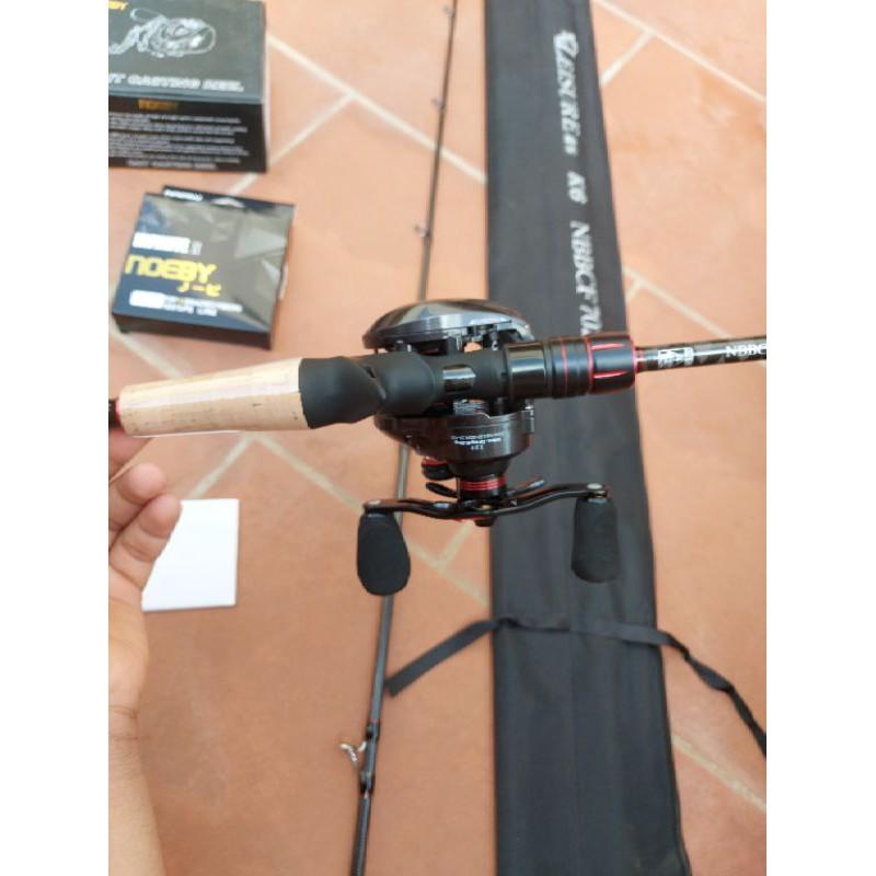 Bộ cần lure ngang noeby k6, máy noeby nonsuch pro, dù noeby