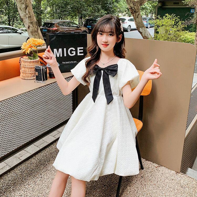 DONGSHOP HOT Cô gái bong bóng nước ngoài tay áo đầm mùa hè 2023 Hàn Quốc trẻ em Bowknot váy công chúa váy mùa hè