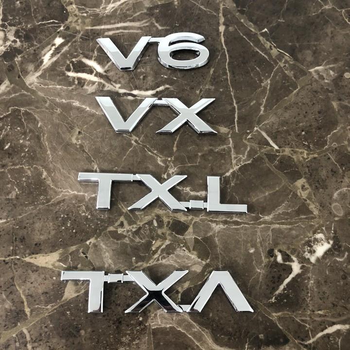 Decal tem chữ inox V6, VX, TX.L, VX.L dán đuôi xe ô tô