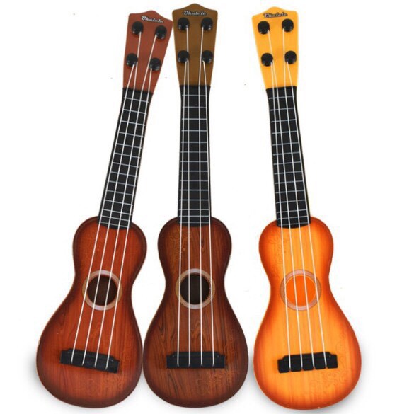Đàn Ukulele Nhựa Cho Bé Đàn Ghi Ta Mini Nhiều Mẫu Dễ Thương Cho Bé Màu Vân Gỗ Giao Hoạ Tiết Ngẫu Nhiên