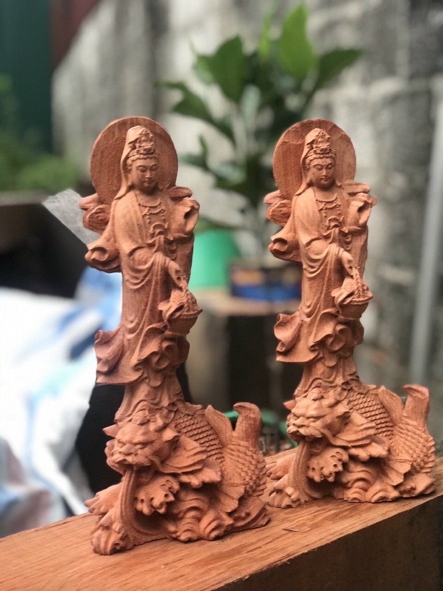 Tượng phật bà cưỡi cá chép bằng gỗ hương đá