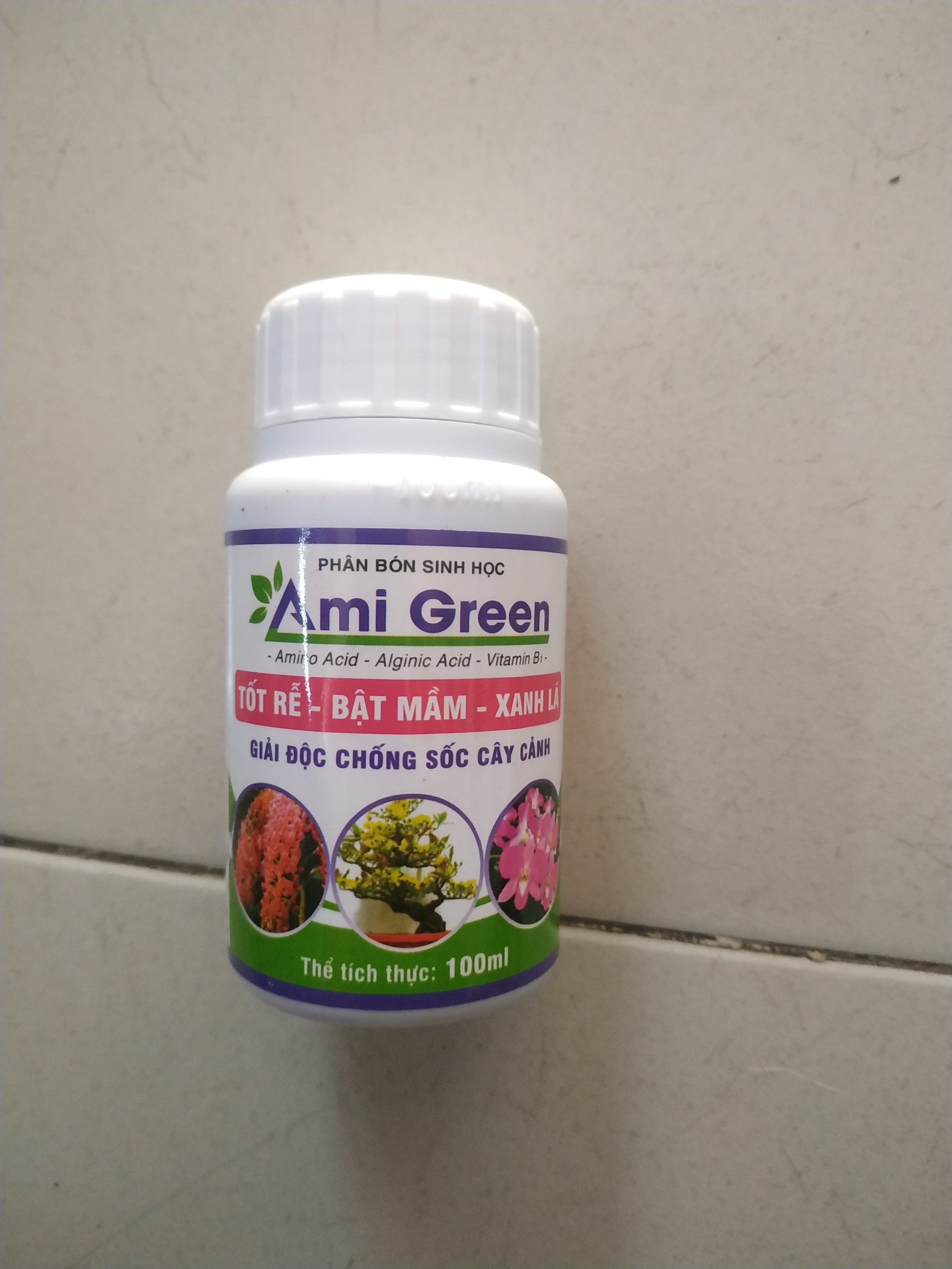 Phân bón sinh học giải độc cây trồng AMI GREEN.Chuyên dùng cho lan , hồng, cây kiểng Giúp tốt rễ, bật mầm, xanh lá chai 100ml.