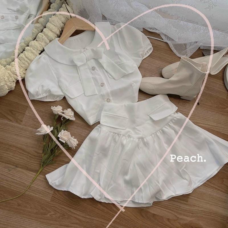Set áo croptop trắng cổ sen đính nơ phối chân váy xếp ly