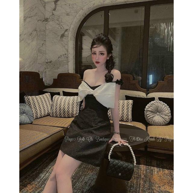 Đầm xòe gấm trễ vai nơ xoắn