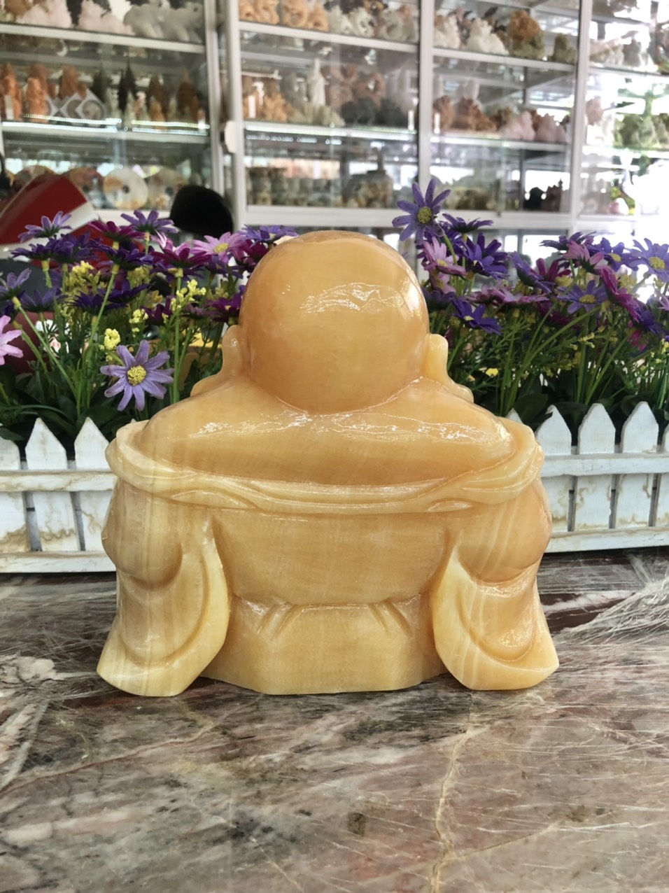 Tượng Phật Di Lặc ngồi cầm thỏi vàng đá ngọc hoàng long - Dài 20cm