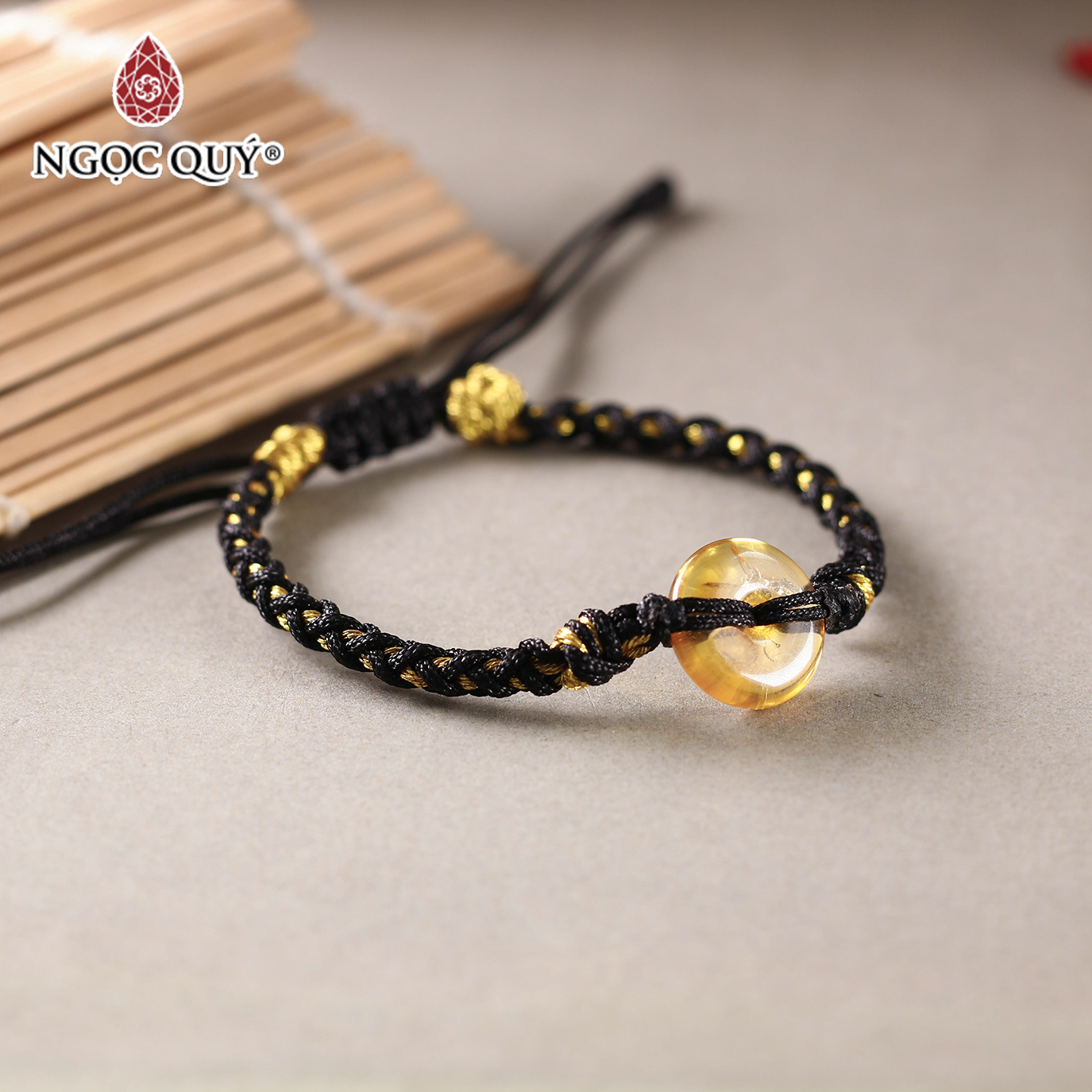 Vòng tay thắt dây đồng điếu hổ phách - Ngọc Quý