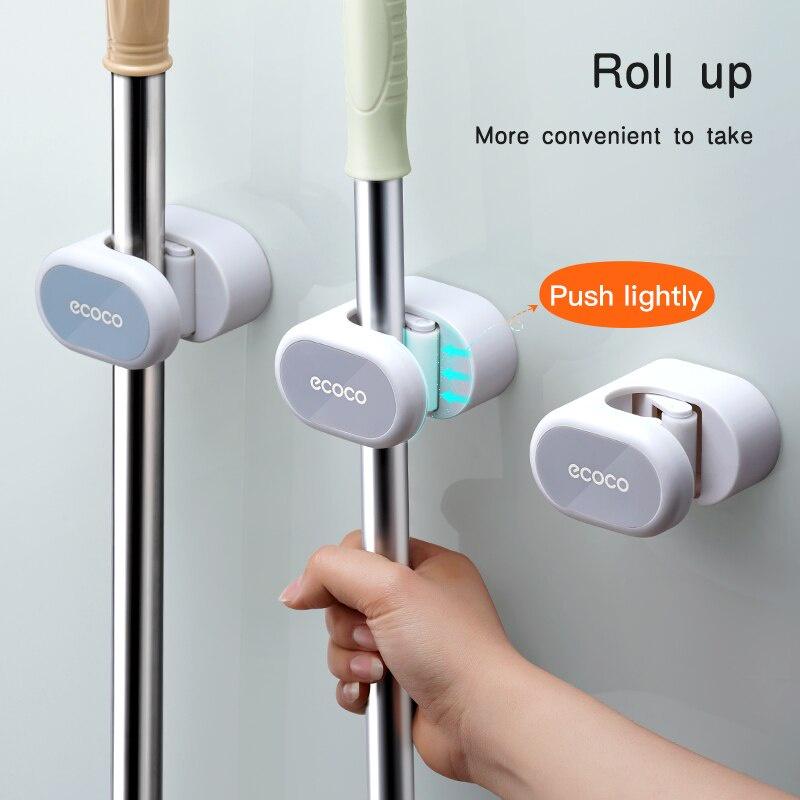 Giá đỡ dán tường treo cây lau nhà, chổi trong phòng tắm.
