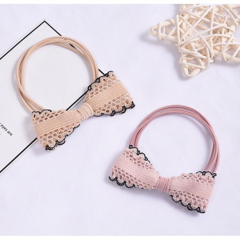 Thun buộc tóc hình nơ