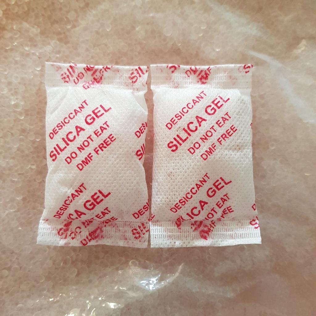 Gói hút ẩm tủ quần áo hạt hút ấm thực phẩm máy ảnh cho giày túi xách Silica Gel các loại gói 500 gr