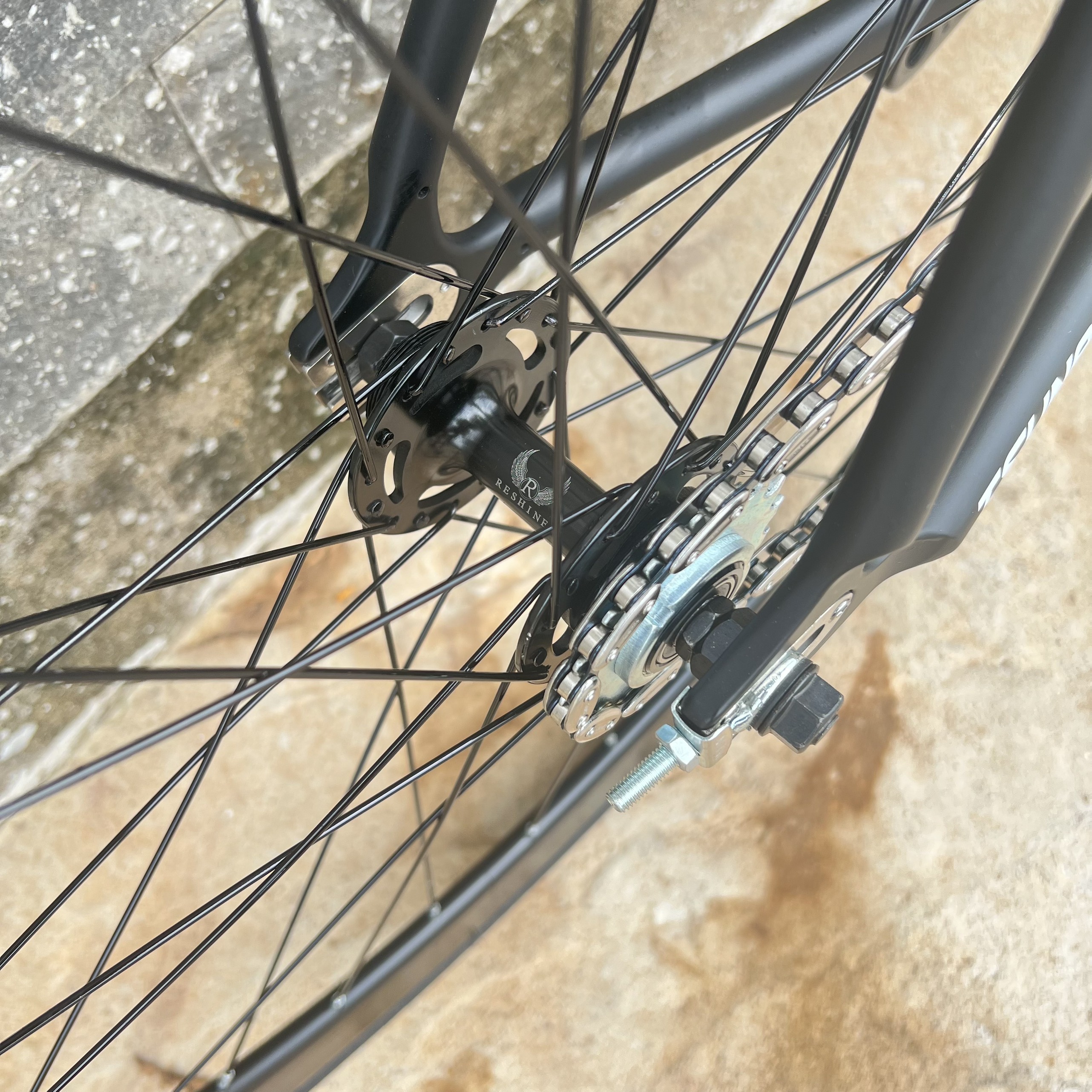 Xe đạp fixed gear TSUNAMI SNM100 nâng cao trước 3 đao đen - Đen chữ trắng
