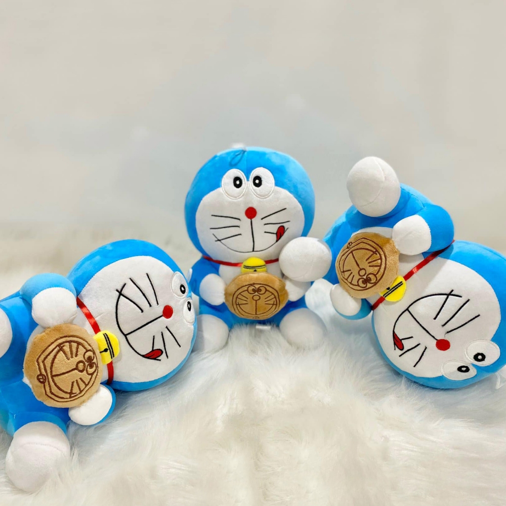 Hình ảnh Thú nhồi bông Doraemon ôm bánh rán - Size từ 40cm đến 80cm - Quà tặng gấu bông Doraemon dễ thương.