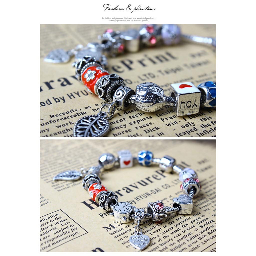 Vòng tay charm đồng hồ và chiếc lá