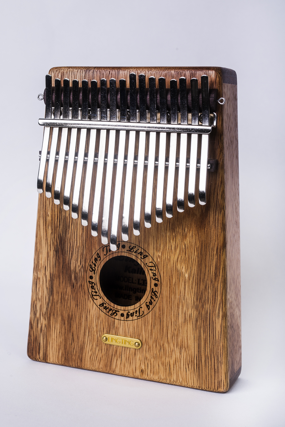 Đàn Kalimba LingTing 17 Phím Gỗ Hoàng Đàn LT-K17Y (Hộp cứng chống sốc, Búa chỉnh âm, Dây treo trang trí, Khăn lau, Sticker dán note, Sách học, Ling Ting K17Y) - Kèm Kèn Kazoo DreamMaker.