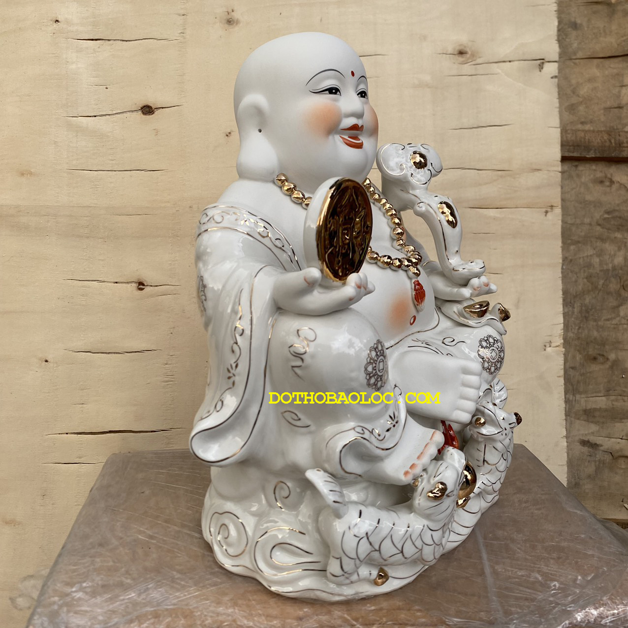Tượng phật di lặc cầm đồng t.iền bằng sứ cao 35cm