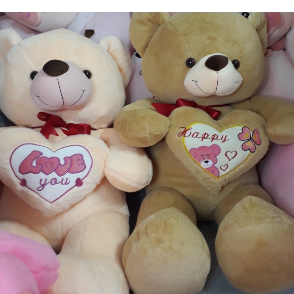 Hình ảnh Gấu bông Teddy ôm tim - Size từ 1m1 đến 1m5 - Quà tặng gấu bông teddy vải lông tuyết mịn.
