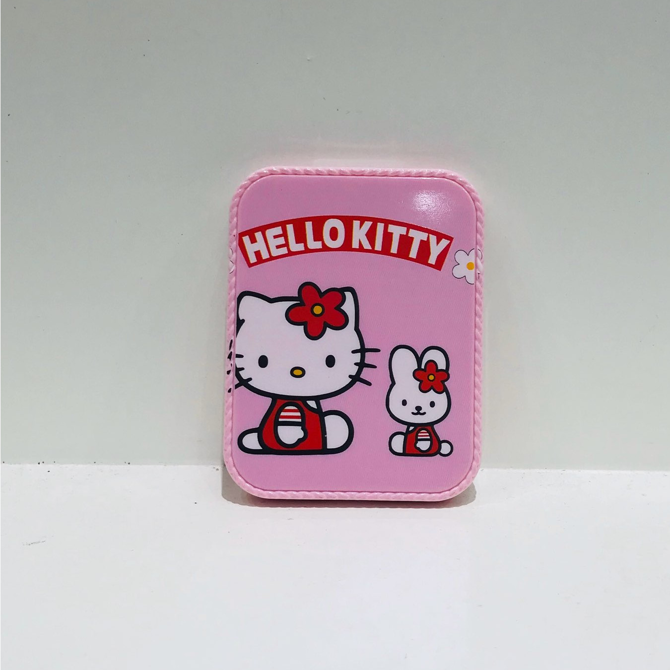 Gương kèm lược chữ nhật viền răng cưa Hello Kitty