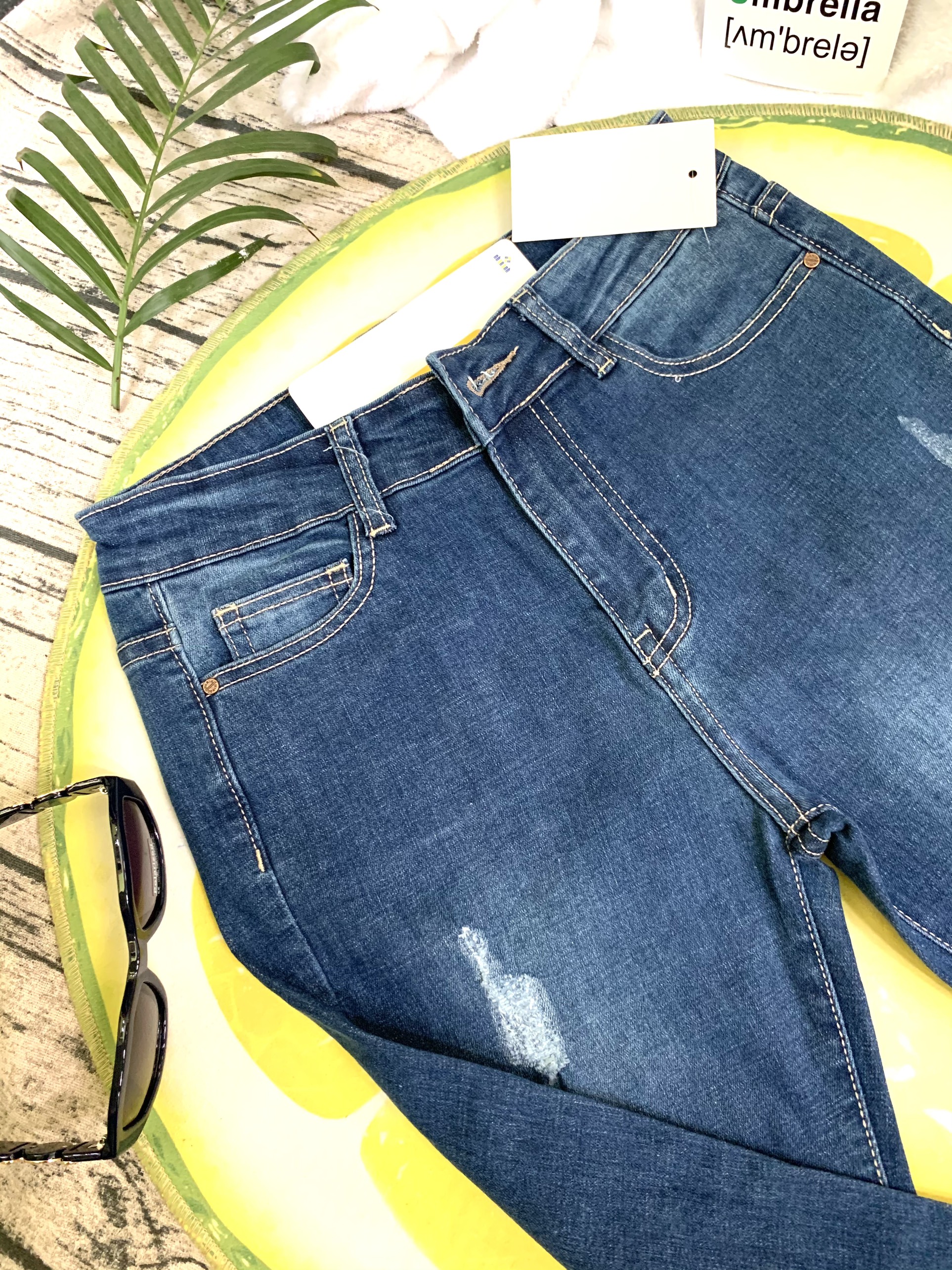 Quần jeans ống loe lai tua rua