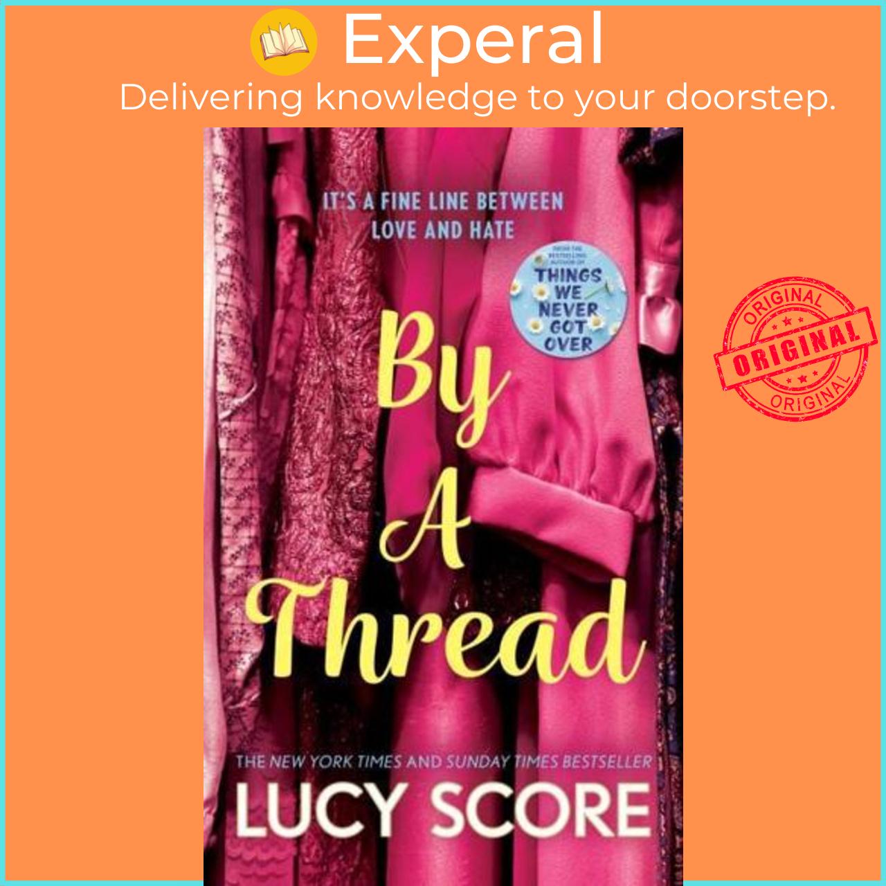 Sách - By a Thread by Lucy Score (UK edition, Paperback)