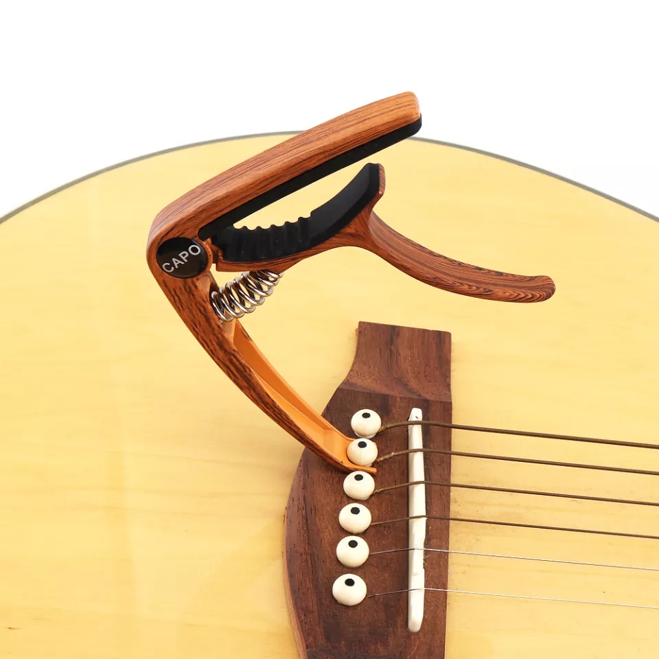 Capo Nâng Tone - Kẹp Cần Đàn Guitar Acoustic JX-05 (Kèm 3 Pick Gảy )