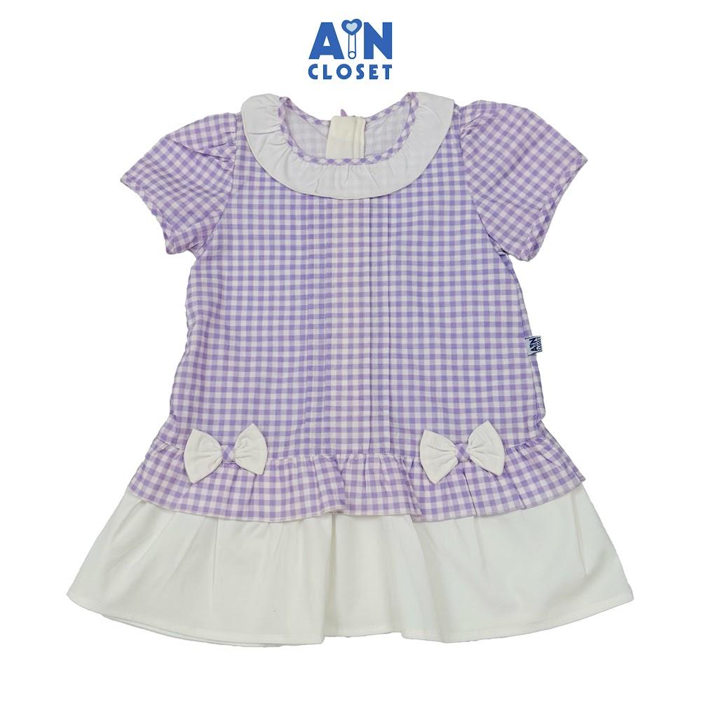 Đầm bé gái hoạ tiết Caro Nơ Tím Cotton - AICDBGJTUDKF - AIN Closet