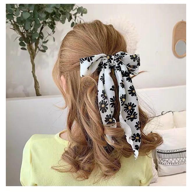Cột tóc nơ hoa cúc dài tiểu thư sang trọng Tatitava