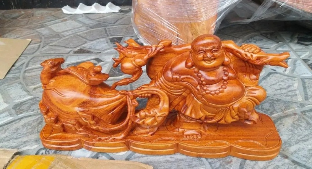 Tượng phật di lặc kéo bao tiền gỗ hương ngang 46 cm