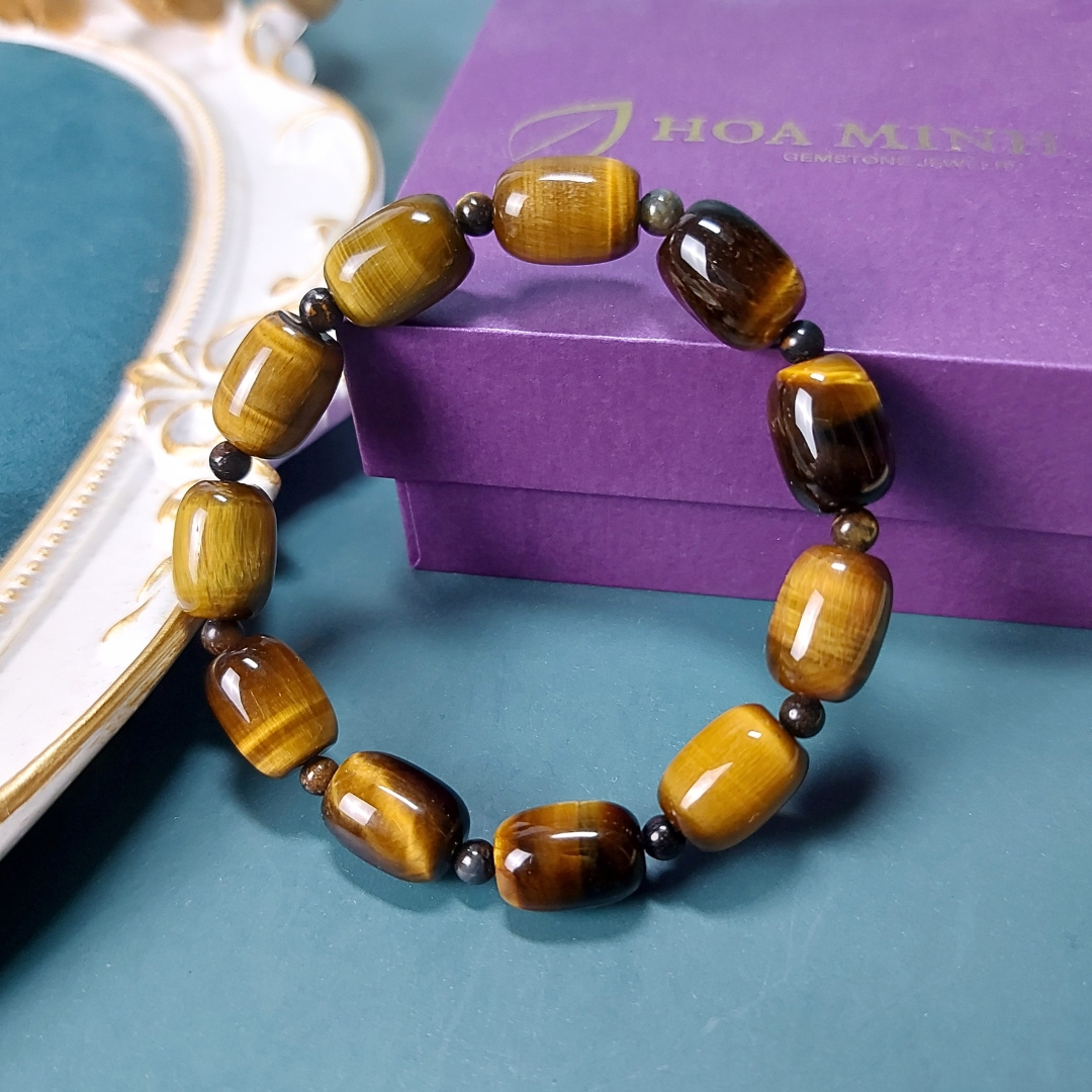 Vòng tay đá Mắt Hổ vàng nâu size 14x10 li chất 4A kiểu lu thống phối xen kẽ viên mắt hổ tròn