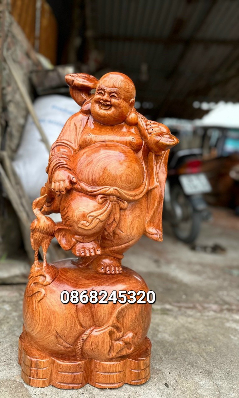 Tượng phật di lặc dắt cò bằng gỗ hương đá kt cao 60×26×24cm